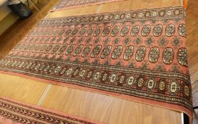 Persian style runner on red ground with black guard, geometric pattern, 2.