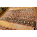 Persian style runner on red ground with black guard, geometric pattern, 2.