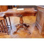 An early Victorian rosewood swivel top card table with baize lined interior,