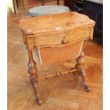 A Victorian walnut folding top games table opening to reveal a chequer board and backgammon and