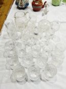 Set of 10 cut glass tumblers, set of 10 cut glass goblets, cut water jug and wine decanter,