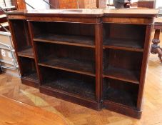 A Victorian mahogany breakfront open bookcase, of six adjustable shelves, raised on a plinth base,