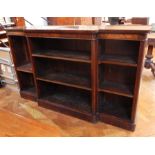 A Victorian mahogany breakfront open bookcase, of six adjustable shelves, raised on a plinth base,