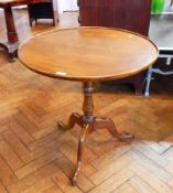 A Georgian style mahogany circular dish top tripod table with birdcage,