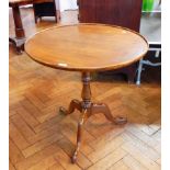 A Georgian style mahogany circular dish top tripod table with birdcage,