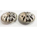 A pair of silver plated entree dishes and covers, with cast floral finials and reeded borders,