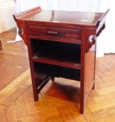 A Chinese hardwood side table with raised ends, frieze drawer, open cupboard below, side brackets,