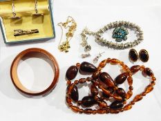 A quantity of costume jewellery to include cufflink set, bangle, bead necklaces, etc.