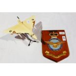 A metal Westway model of a Vulcan with a plastic model of a Vulcan and a armorial crest for the