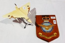 A metal Westway model of a Vulcan with a plastic model of a Vulcan and a armorial crest for the