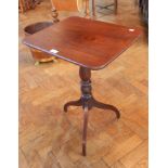 A 19th century rectangular tilt-top tripod table on turned baluster column,