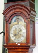 An 18th century walnut longcase clock, with canopied hood, brass dial with silvered chapter ring,
