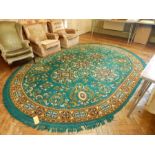 Oval carpet with green field, floral decoration, brown guards, 3.8m x 2.