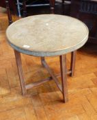 An Eastern brass circular top occasional table on folding stand,