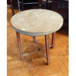 An Eastern brass circular top occasional table on folding stand,