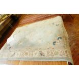 Chinese wool rug on pale blue ground, floral and scroll decoration,