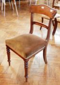 A set of six William IV mahogany dining chairs, with foliate carved bar backs,