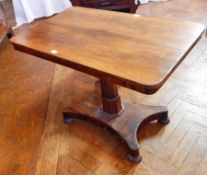 A Victorian rosewood rectangular top side table on faceted tapering column to platform base and