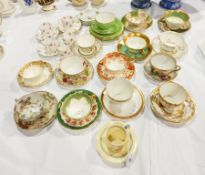 A collection of cabinet cups and saucers, various makers including Royal Crown Derby, Coalport,