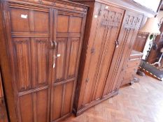 An oak wardrobe with linenfold decoration and pear-drop handles, another,