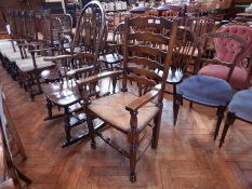 A figured ladderback carvers chair with wicker seat,