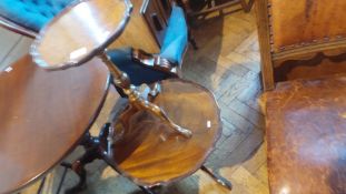 A small wine table with wavy edge top and bird's eye maple veneer,