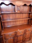 An open-top dresser with two shelves,