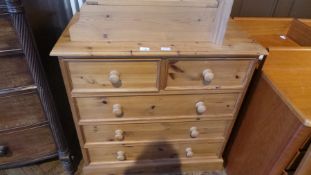 A modern pine chest of two short and three long drawers on a plinth base,