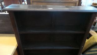 An old stained pine open bookcase of four shelves,