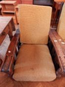 A pair of 20th century oak recliner chairs,