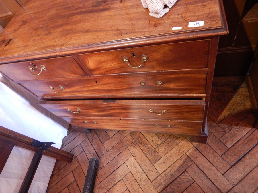 A oak tallboy with two short drawers and three graduating drawers, with U-shaped handles,