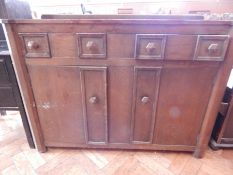 An oak sideboard with two long drawers and hexagonal shaped handles,