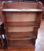 An oak open bookcase of four shelves, width 56cm,