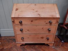 Victorian pine bureau with three pigeonholes, three graduated drawers with bun handles,