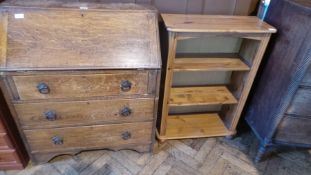 An old oak bureau with fitted interior with three long graduated drawers below, width 83cm,