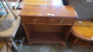 A yewwood veneer open bookcase, with pair of frieze drawers,