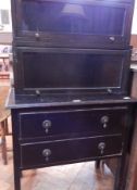 Two stained oak glazed display cabinets and two drawer bedside cabinet on square legs