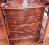 A small mahogany veneer bow front chest of four long drawers on bracket feet, width 46cm,