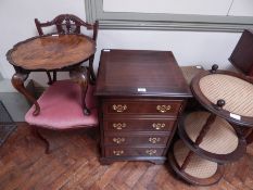 A mahogany piecrust occasional table on cabriole legs, a music cabinet, a three-tier stand,