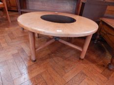 A 20th century pine circular table with glazed middle,