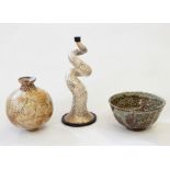 Three various items of studio pottery to include scrolling horn-shaped vase/candlestick with cream