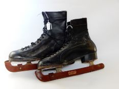 Pair of 20th century Fagan black leather ice skates,