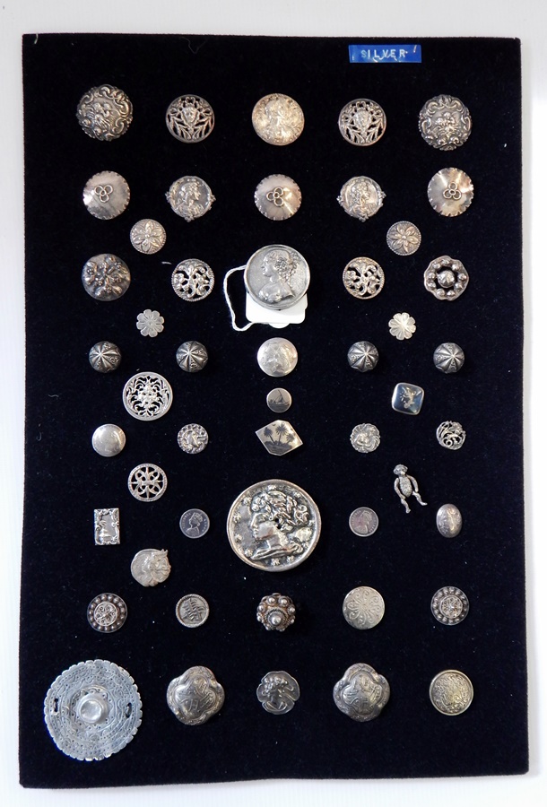 A quantity of silver buttons including Art Nouveau,