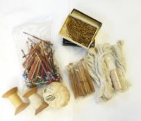 A quantity of wooden bobbins, some named and painted, some with beaded ends,