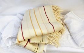 A striped woollen cream shawl together with a Victorian cotton pinny and a Victorian petticoat