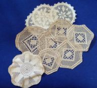 Various crocheted and lace table mats, a quantity of linen,