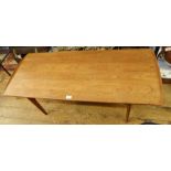 20th century teak coffee table on tapering supports, united by two stretchers,