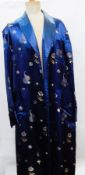 A Chinese style dark blue satin full-length dressing gown with tie belt