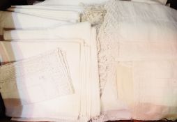 A quantity of damask and other table linen including large tablecloths,