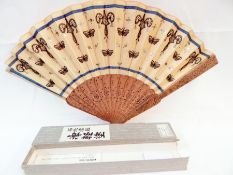 A Chinese wooden brise fan, both guard sticks slightly damaged,